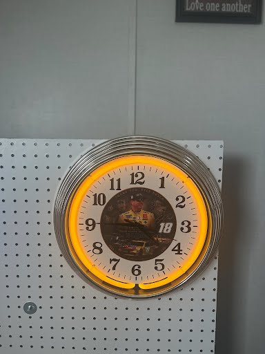 Yellow fox custom neon clock on display wall