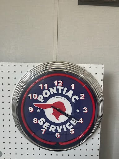 Montana Services custom neon clock on display wall