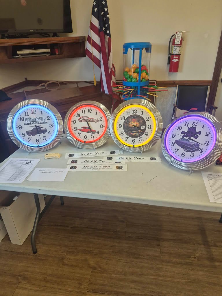 Lineup of custom neon clocks with racing stable designs